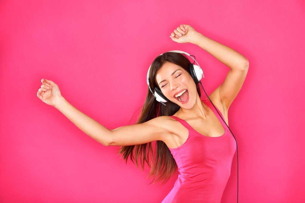 Girl in headphones singing