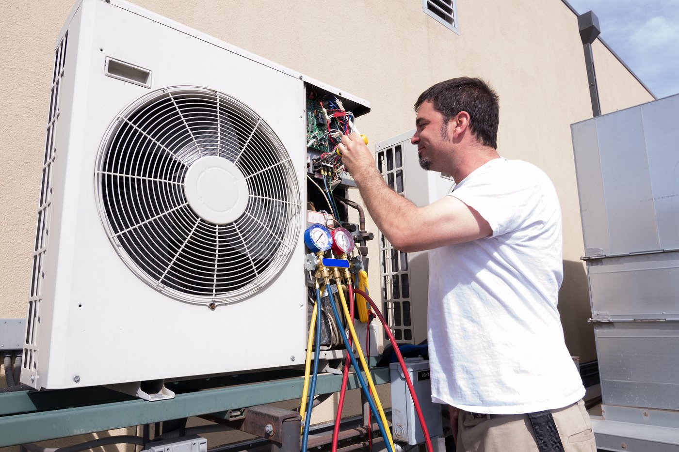 Man inspecting his HVAC system