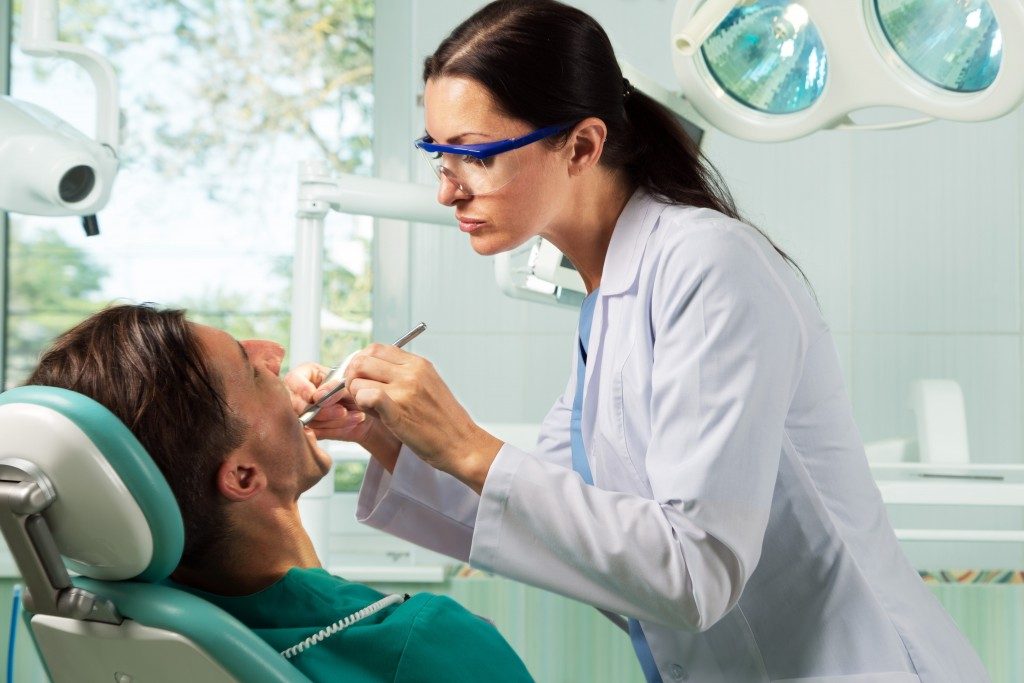 Dentist having oral procedure