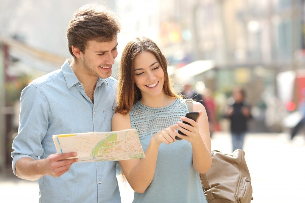 Couple accessing GPS on phone