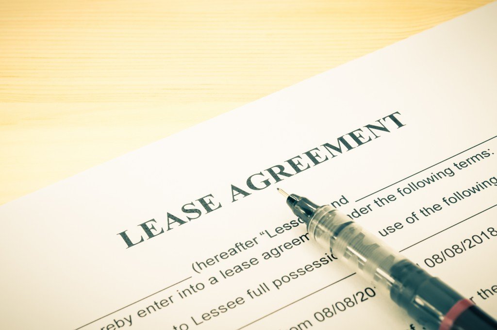 Lease agreement contract sheet and brown pen