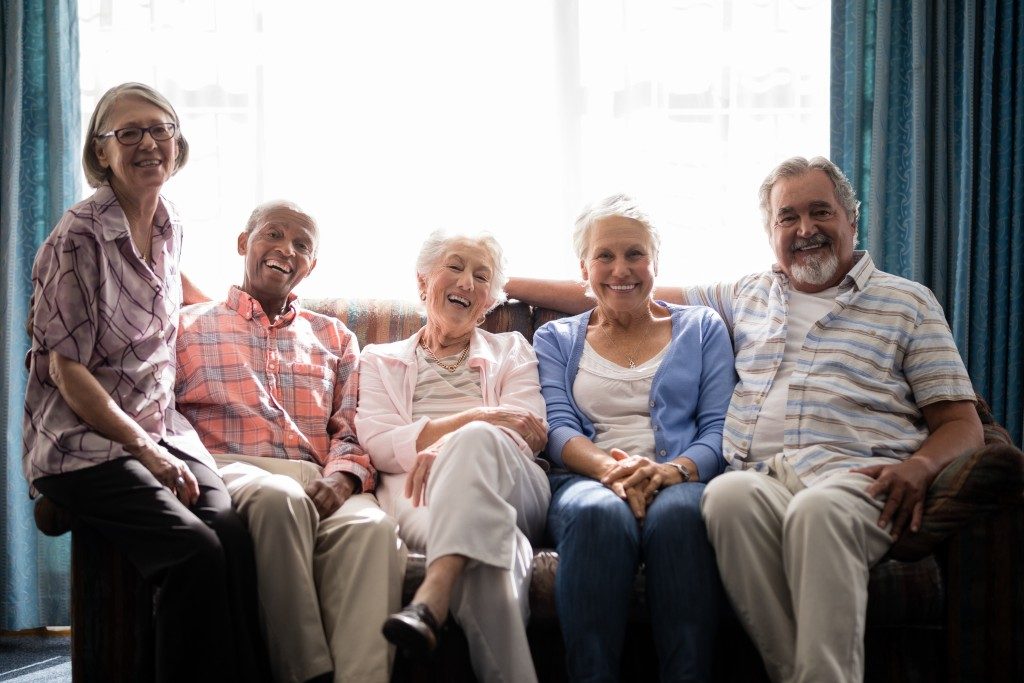 Elderly people sitting on a couch