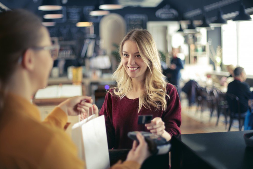 woman shopping using her credit card