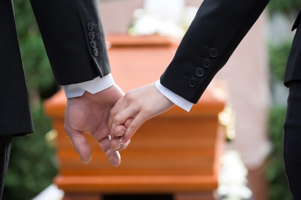 Holding hands during funeral