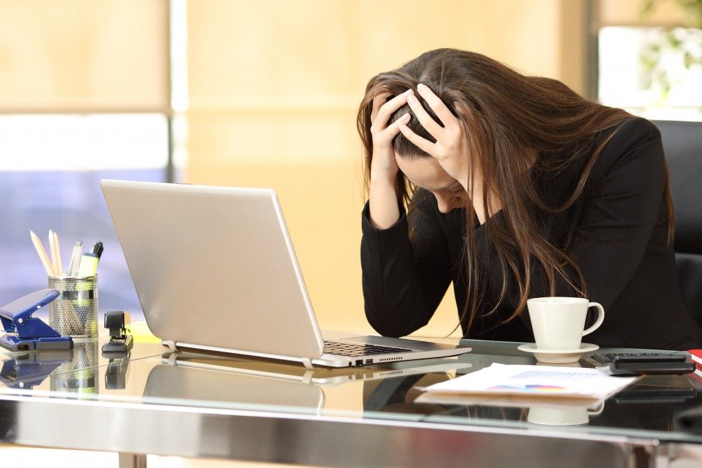 woman feeling stressed at work