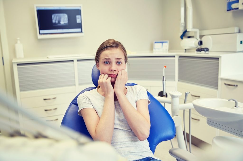 woman feeling nervous at the dentist