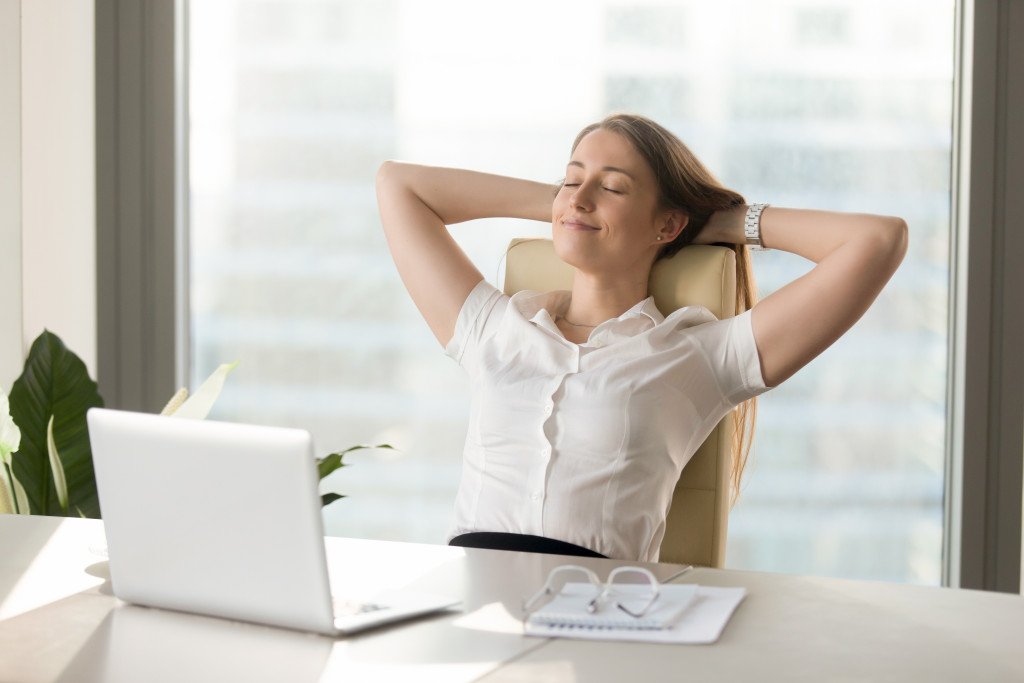 woman relaxing on her desk