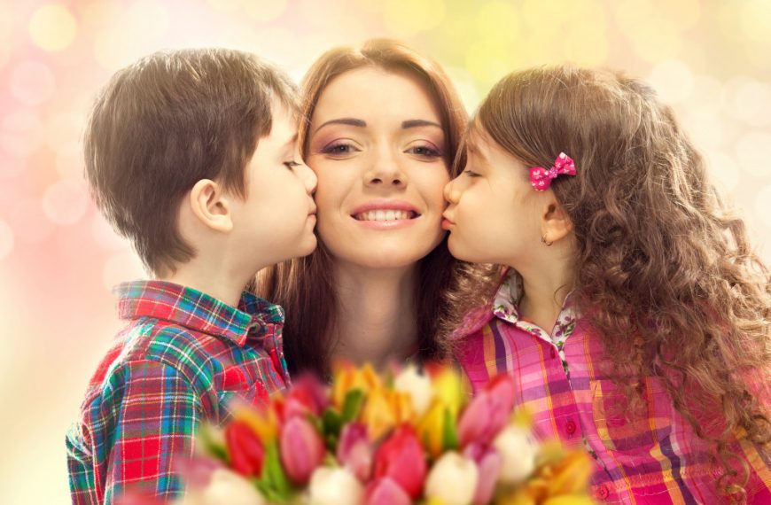 mom being kissed by her kids